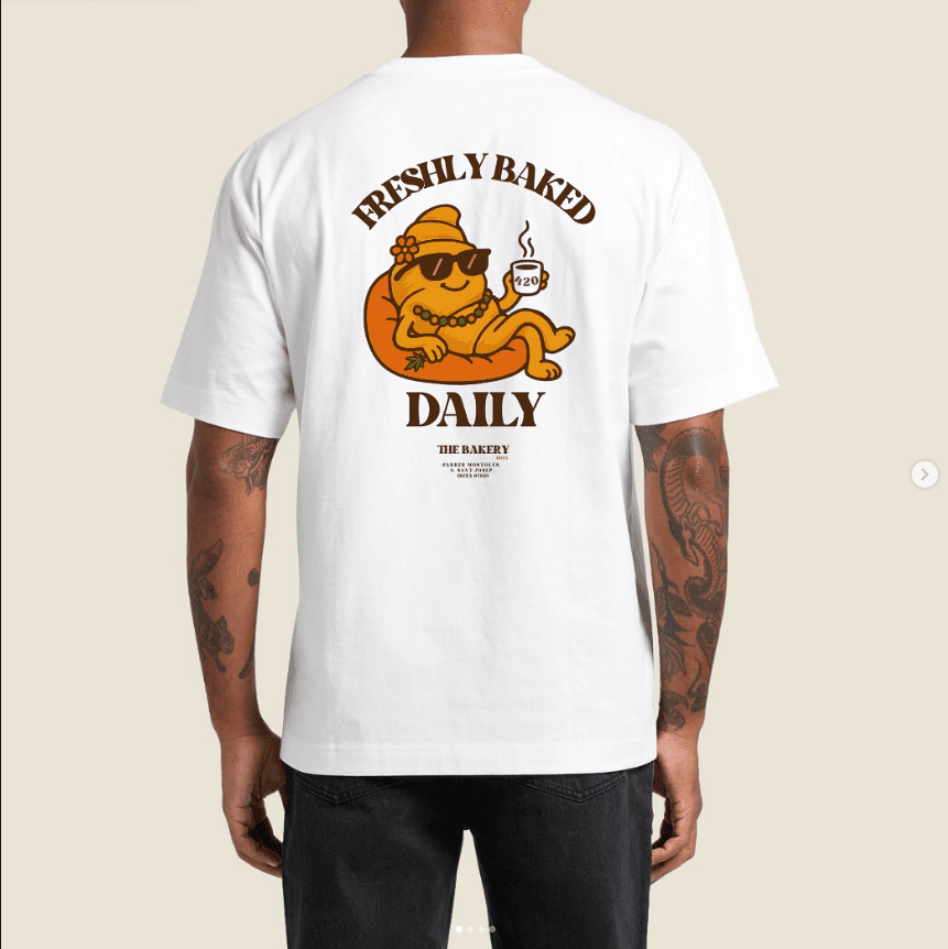 Freshly Baked Daily t-shirt with The Bakery croissant mascot